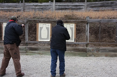 Students shooting the one handed, off hand section in qualification