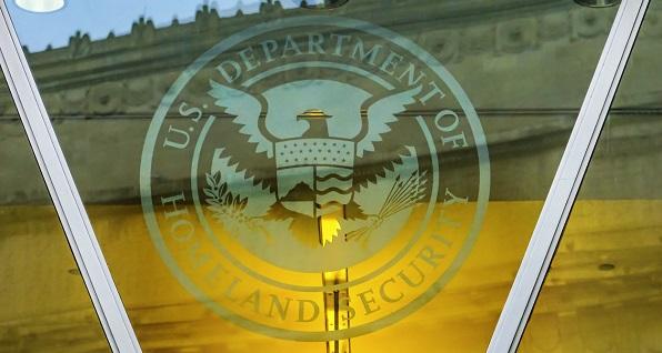 Department of Homeland Security sign outline on building window