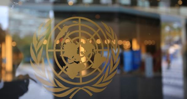 United Nations sign shown in a window