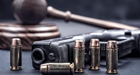 Handgun and court gavel