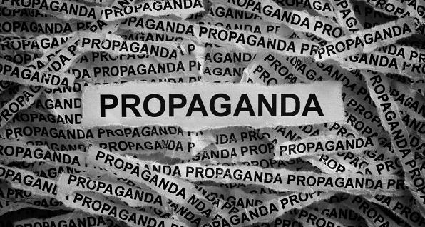 Strips of paper reading "Propaganda"
