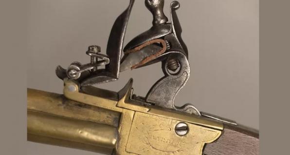 This Revolutionary War weapon would fire by the flint, held in the jaws, slamming down on the flat face of the steel, and striking sparks into the flash pan below the steel. The powder in the pan would ignite the charge in the barrel through a tiny touchhole.